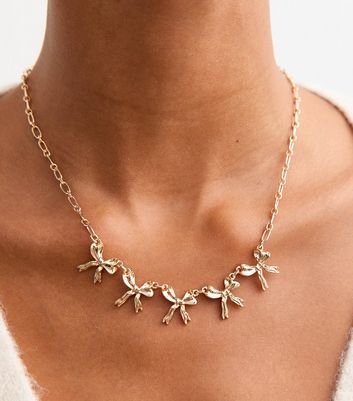 Gold Tone Bow Charm Necklace